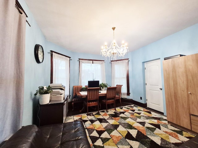 dining area with a notable chandelier