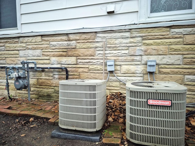 details with cooling unit and stone siding