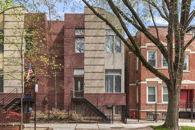 535 N Wood St, Chicago, IL 60622 - exterior space with brick siding and a fenced front yard