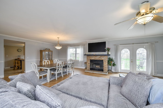 2N252 Diane Ave, Glen Ellyn, IL 60137 - living room featuring ornamental molding, ceiling fan, light wood-style floors, a brick fireplace, and baseboards