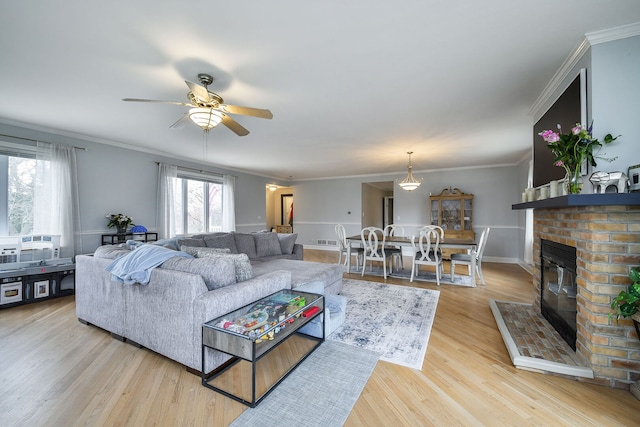 2N252 Diane Ave, Glen Ellyn, IL 60137 - living area featuring ceiling fan, wood finished floors, a fireplace, ornamental molding, and baseboards
