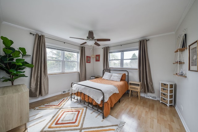 2N252 Diane Ave, Glen Ellyn, IL 60137 - bedroom with multiple windows, light wood-style floors, ornamental molding, baseboards, and a ceiling fan