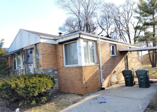 view of home's exterior with brick siding