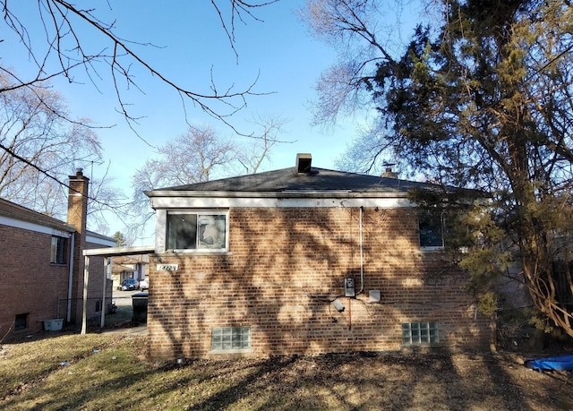view of home's exterior featuring brick siding