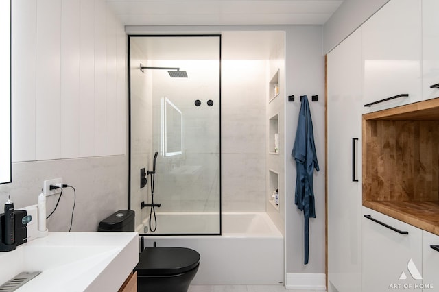 bathroom featuring vanity, shower / tub combination, and toilet