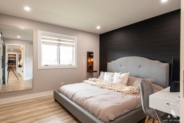 bedroom with recessed lighting, baseboards, visible vents, and light wood finished floors