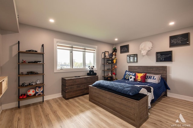 bedroom featuring light wood-type flooring, recessed lighting, and baseboards