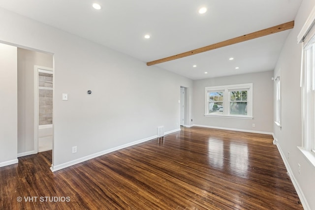 spare room with visible vents, wood finished floors, baseboards, beamed ceiling, and recessed lighting