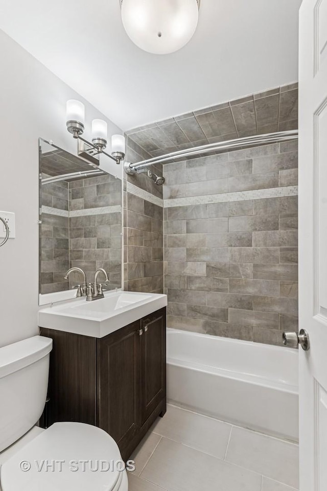 bathroom with shower / bathtub combination, toilet, tile patterned flooring, and vanity
