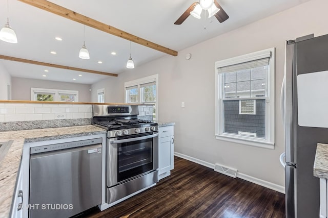 kitchen with visible vents, dark wood-style flooring, beamed ceiling, ceiling fan, and stainless steel appliances