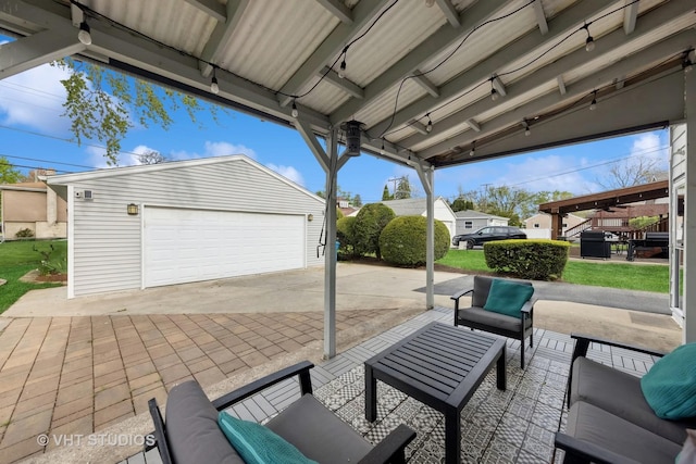 view of patio with an outdoor structure, an outdoor hangout area, and a detached garage