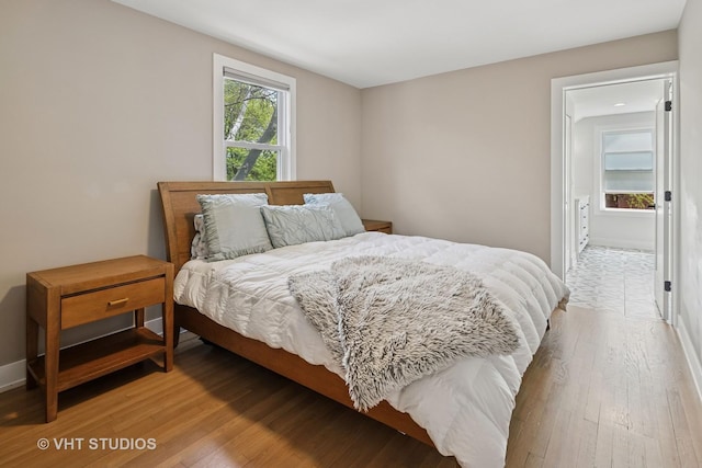 3800 W Eddy St, Chicago, IL 60618 - bedroom featuring baseboards and light wood-type flooring