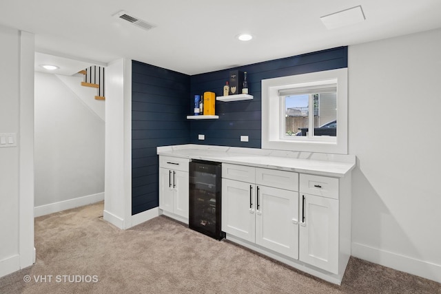 3800 W Eddy St, Chicago, IL 60618 - bar featuring visible vents, stairway, baseboards, wine cooler, and light carpet