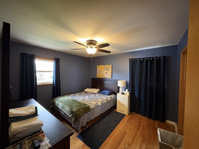 bedroom with wood finished floors and a ceiling fan