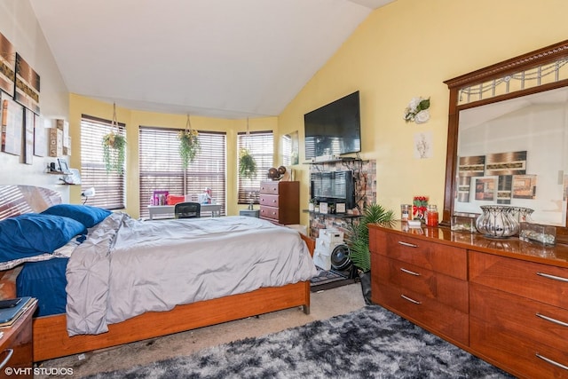 carpeted bedroom with vaulted ceiling