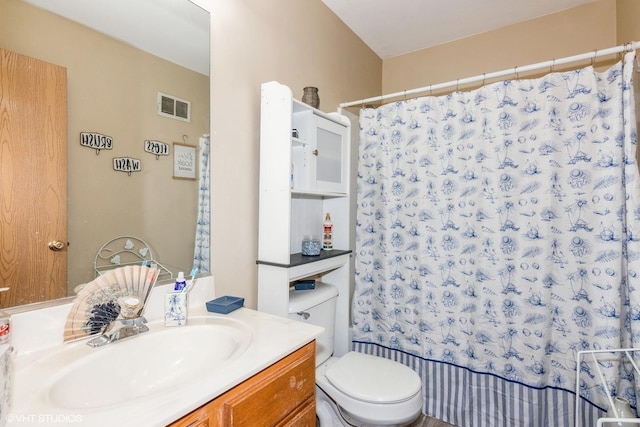 bathroom with visible vents, toilet, a shower with shower curtain, and vanity