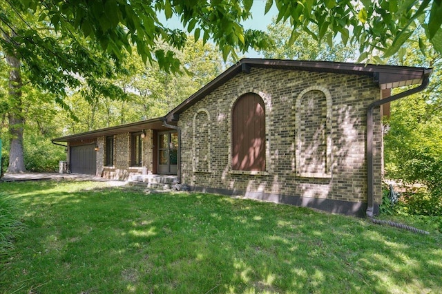 1N721 Neltnor Blvd, West Chicago, IL 60185 - view of front of house featuring a front lawn, brick siding, and a garage