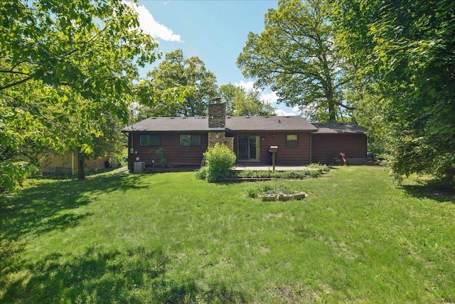 1N721 Neltnor Blvd, West Chicago, IL 60185 - back of house with a chimney, a yard, and a patio area