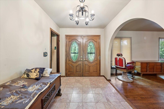 1N721 Neltnor Blvd, West Chicago, IL 60185 - entrance foyer featuring arched walkways and a chandelier
