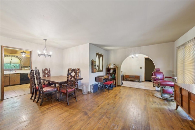 1N721 Neltnor Blvd, West Chicago, IL 60185 - dining space with arched walkways, light wood-style floors, and a chandelier