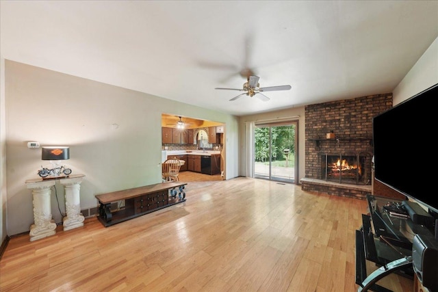 1N721 Neltnor Blvd, West Chicago, IL 60185 - living area with a ceiling fan, a brick fireplace, and light wood-type flooring