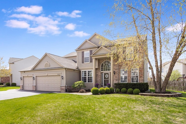 view of front of home featuring an attached garage, driveway, a front lawn, and brick siding