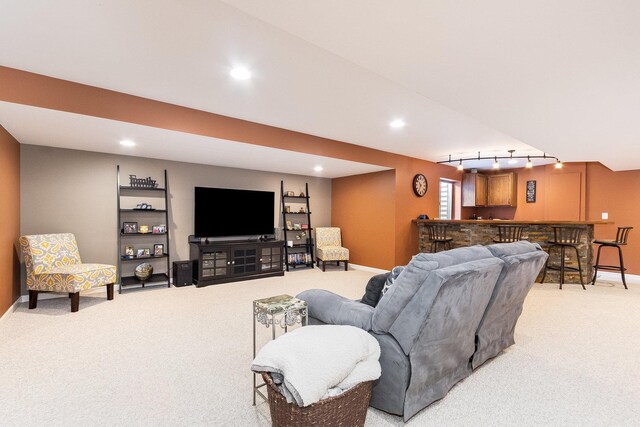 living area with light colored carpet, recessed lighting, baseboards, and track lighting