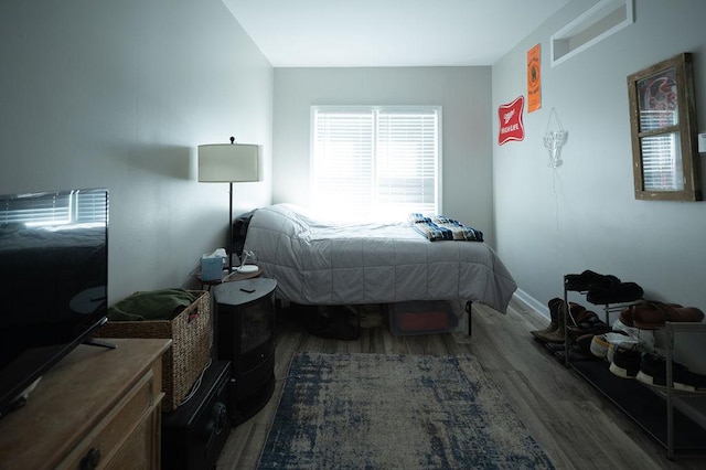 bedroom featuring wood finished floors