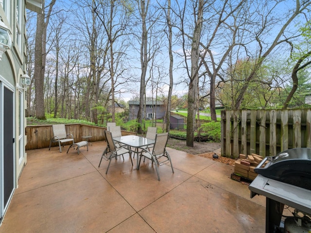 view of patio / terrace featuring fence and outdoor dining space