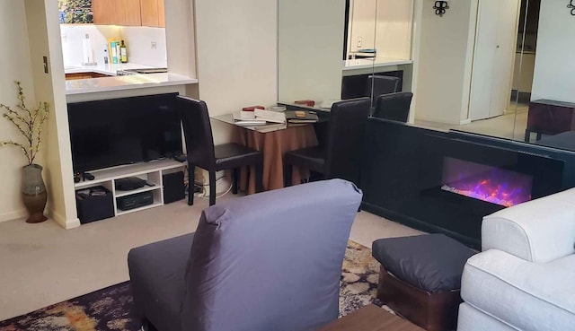living room with baseboards and carpet
