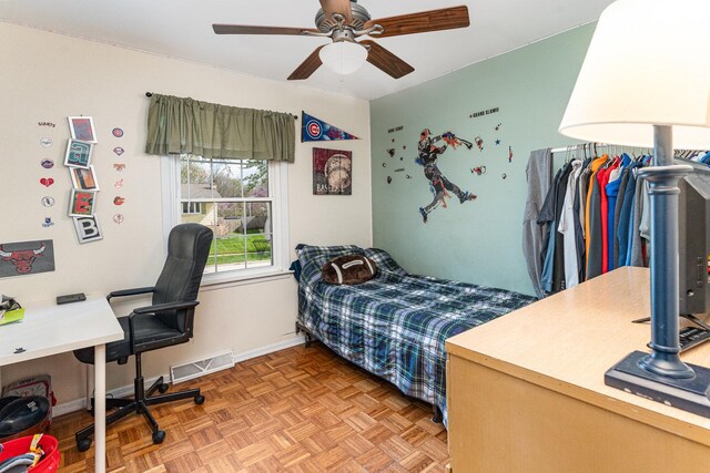 bedroom featuring visible vents, a ceiling fan, and baseboards