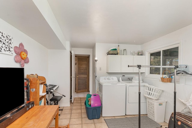 laundry room with washer and clothes dryer and cabinet space