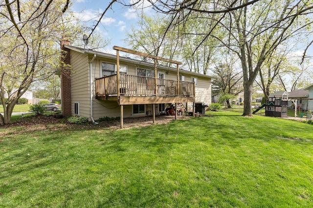 back of house with a wooden deck, a chimney, and a yard