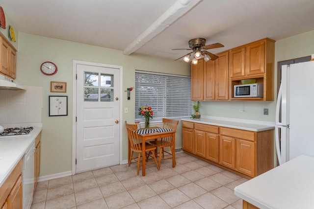 kitchen with a ceiling fan, light tile patterned floors, light countertops, under cabinet range hood, and white appliances