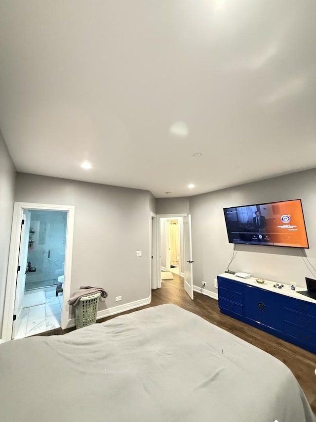 bedroom with recessed lighting, dark wood-style flooring, connected bathroom, and baseboards
