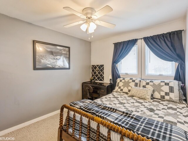 bedroom with baseboards, a ceiling fan, and carpet flooring