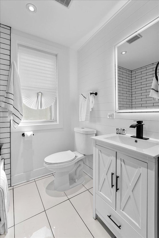 bathroom with tile patterned floors, recessed lighting, toilet, and vanity