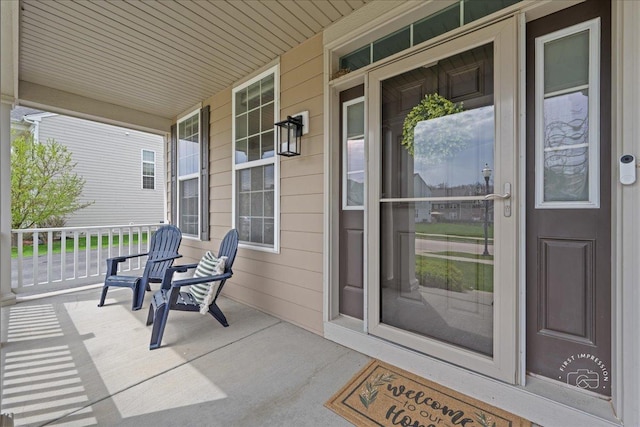 property entrance featuring a porch