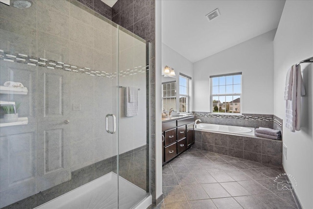bathroom featuring vaulted ceiling, a shower stall, visible vents, and vanity