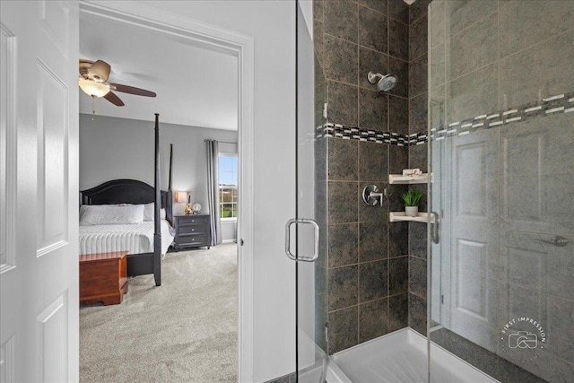 bathroom featuring a ceiling fan, a shower stall, and ensuite bathroom