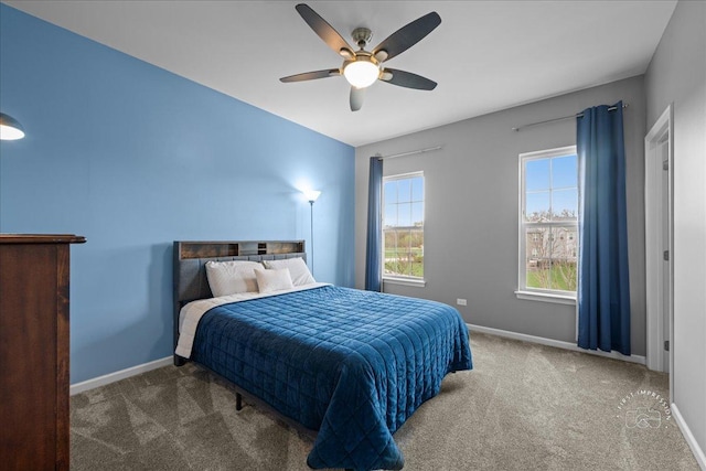 bedroom featuring baseboards, a ceiling fan, and carpet