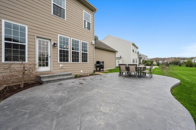 view of patio / terrace featuring outdoor dining area, entry steps, and area for grilling