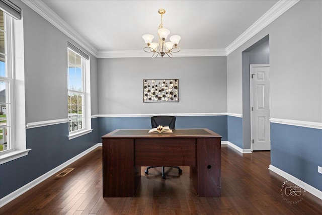 office space with plenty of natural light, a notable chandelier, dark wood finished floors, and visible vents