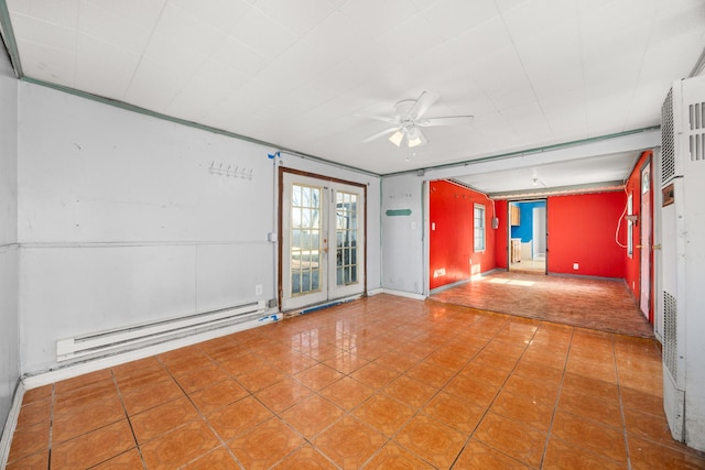 tiled spare room with a baseboard radiator and ceiling fan