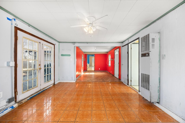 hallway featuring a heating unit, a wealth of natural light, and tile patterned flooring