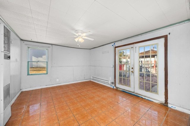 spare room featuring baseboard heating, light tile patterned floors, ceiling fan, and french doors