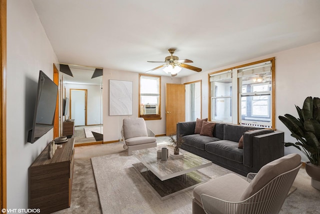 1309 Maple Ave, Berwyn, IL 60402 - carpeted living room featuring ceiling fan, baseboards, and cooling unit