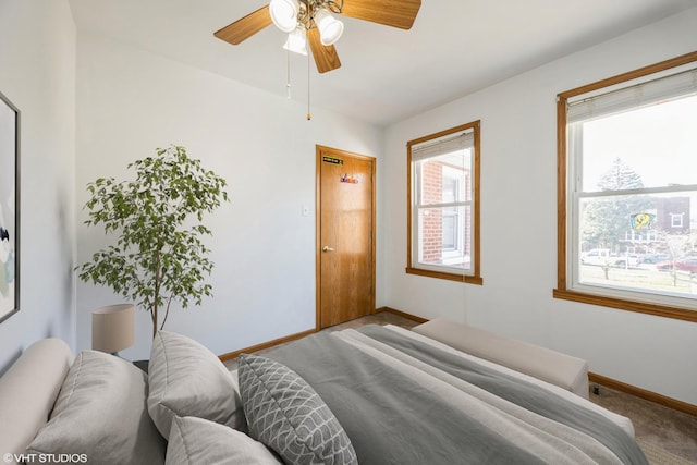 1309 Maple Ave, Berwyn, IL 60402 - bedroom with baseboards, ceiling fan, and carpet
