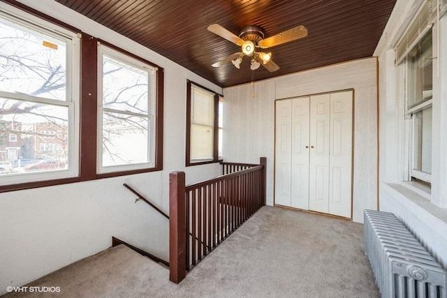 1309 Maple Ave, Berwyn, IL 60402 - stairway with carpet flooring, ceiling fan, a wealth of natural light, and radiator heating unit