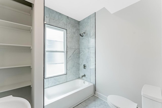 822 N Lockwood Ave, Chicago, IL 60651 - bathroom with toilet, washtub / shower combination, marble finish floor, and plenty of natural light